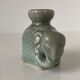 Porcelain candle holder and celadon cover in the shape of an elephant