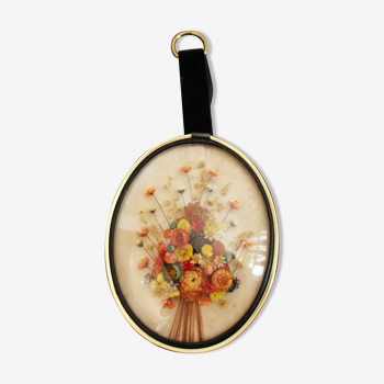 Médaillon vintage verre bombé fleurs séchées noir doré