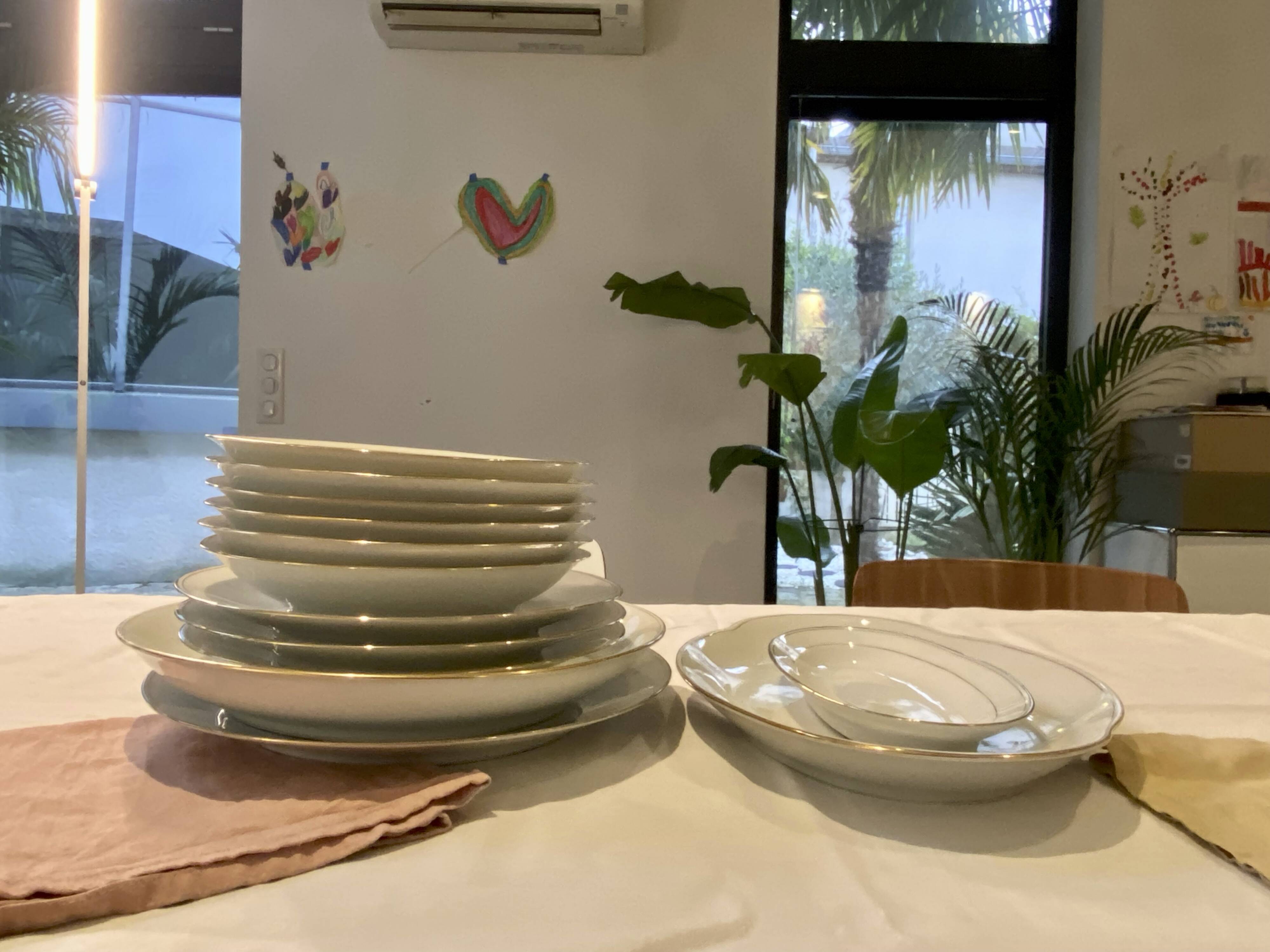 Vintage table service Limoges porcelain white with gold trim.