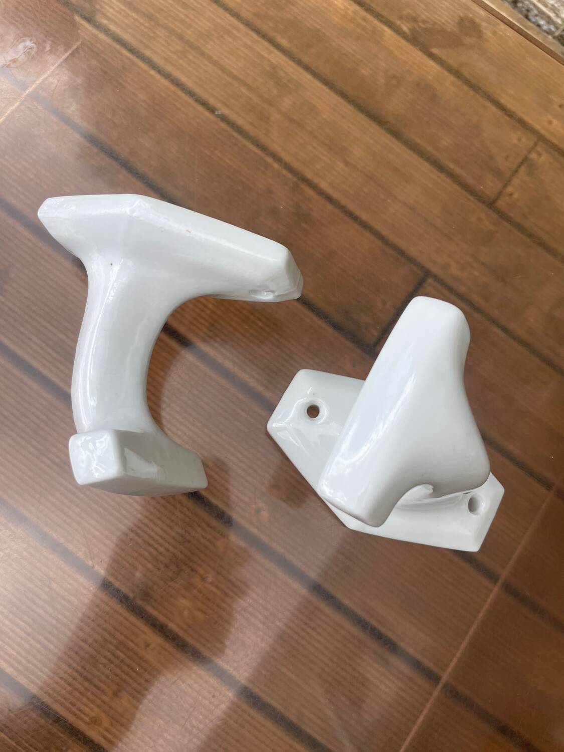 Duo of porcelain hooks