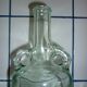 Old transparent moulded glass bottle