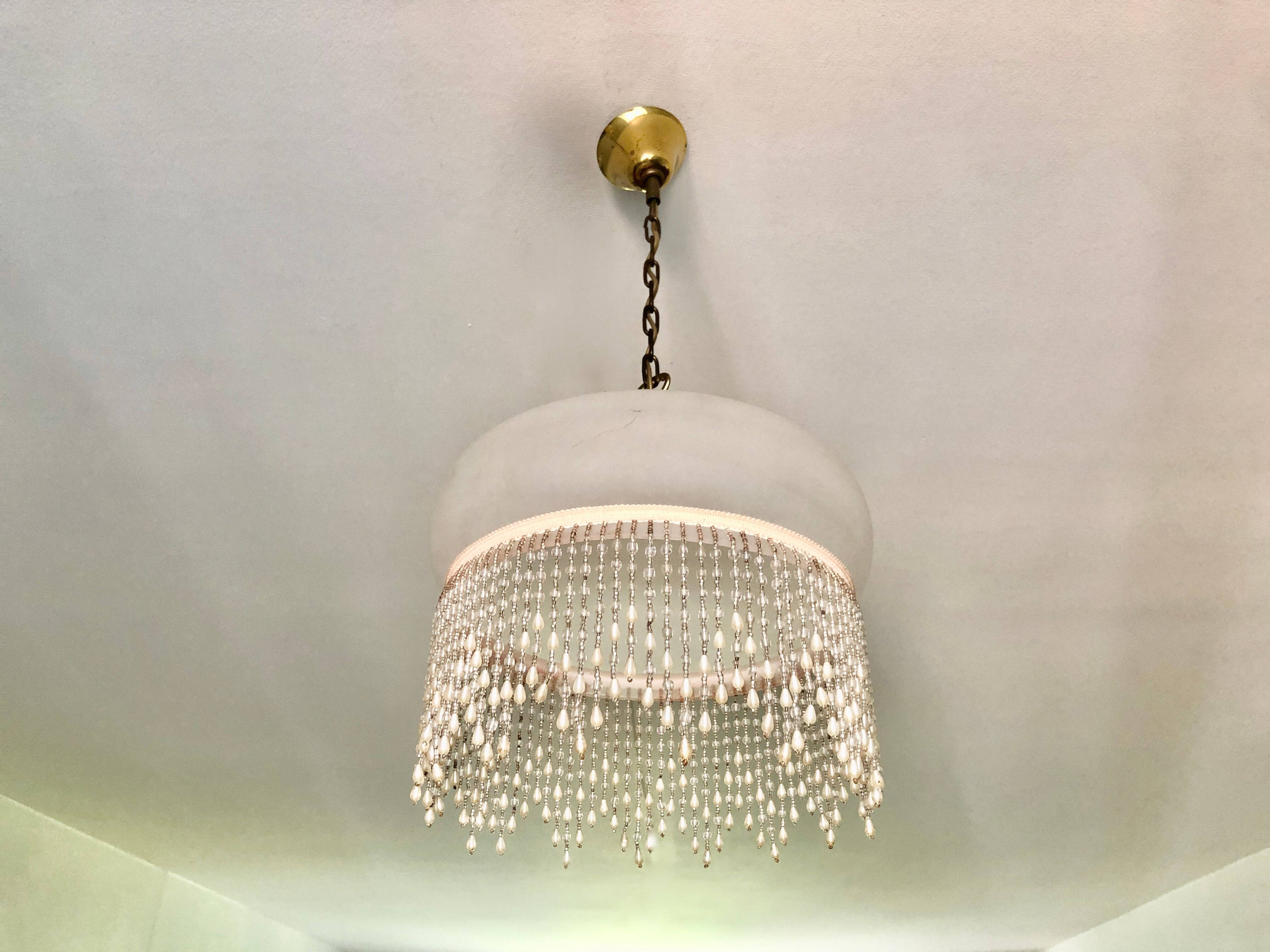 Pink half-shell suspension with pearl fringe