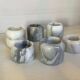 Six bougeoirs en marbre