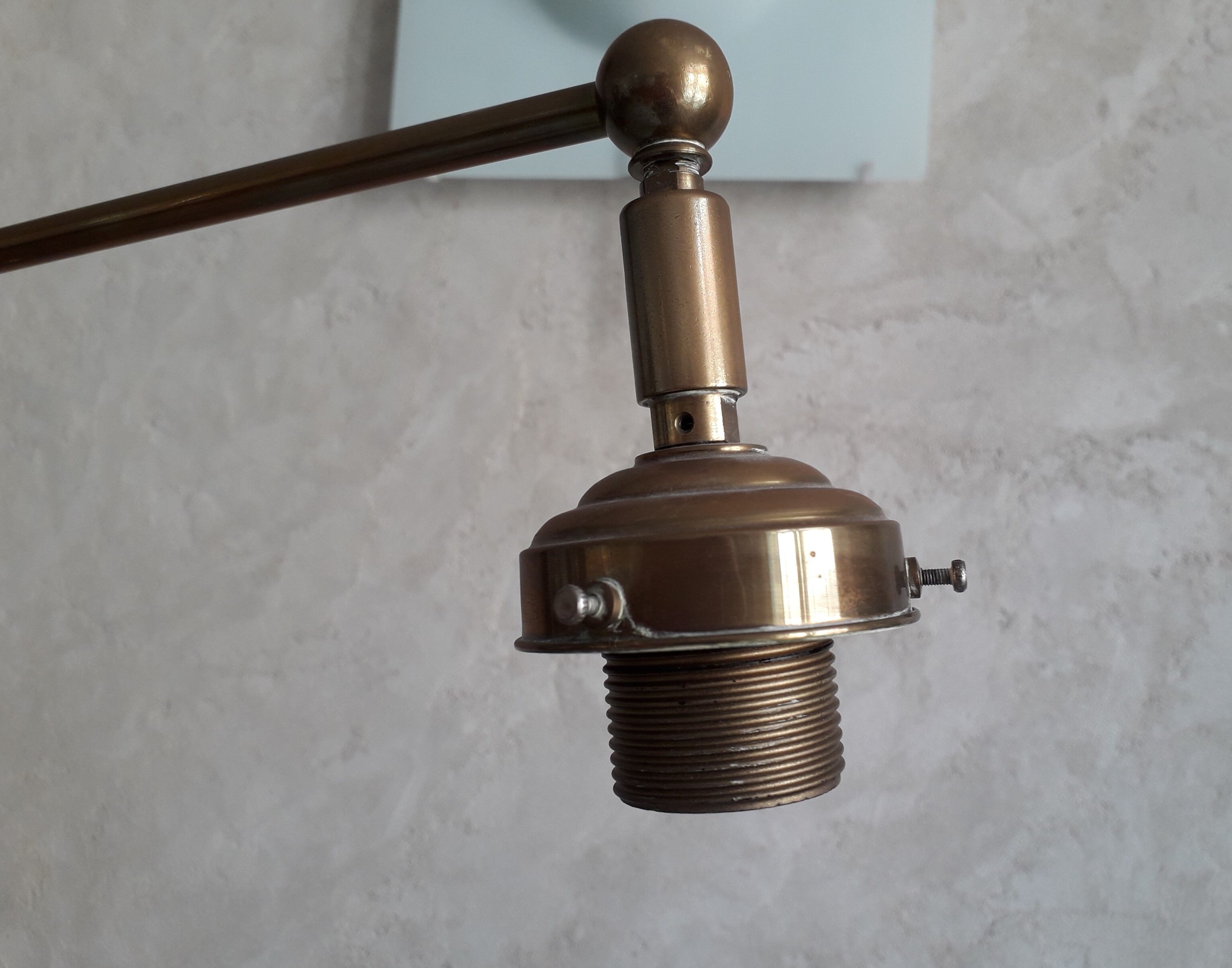 Articulated brass floor lamp