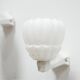 Pair of art deco porcelain and glass wall appliques