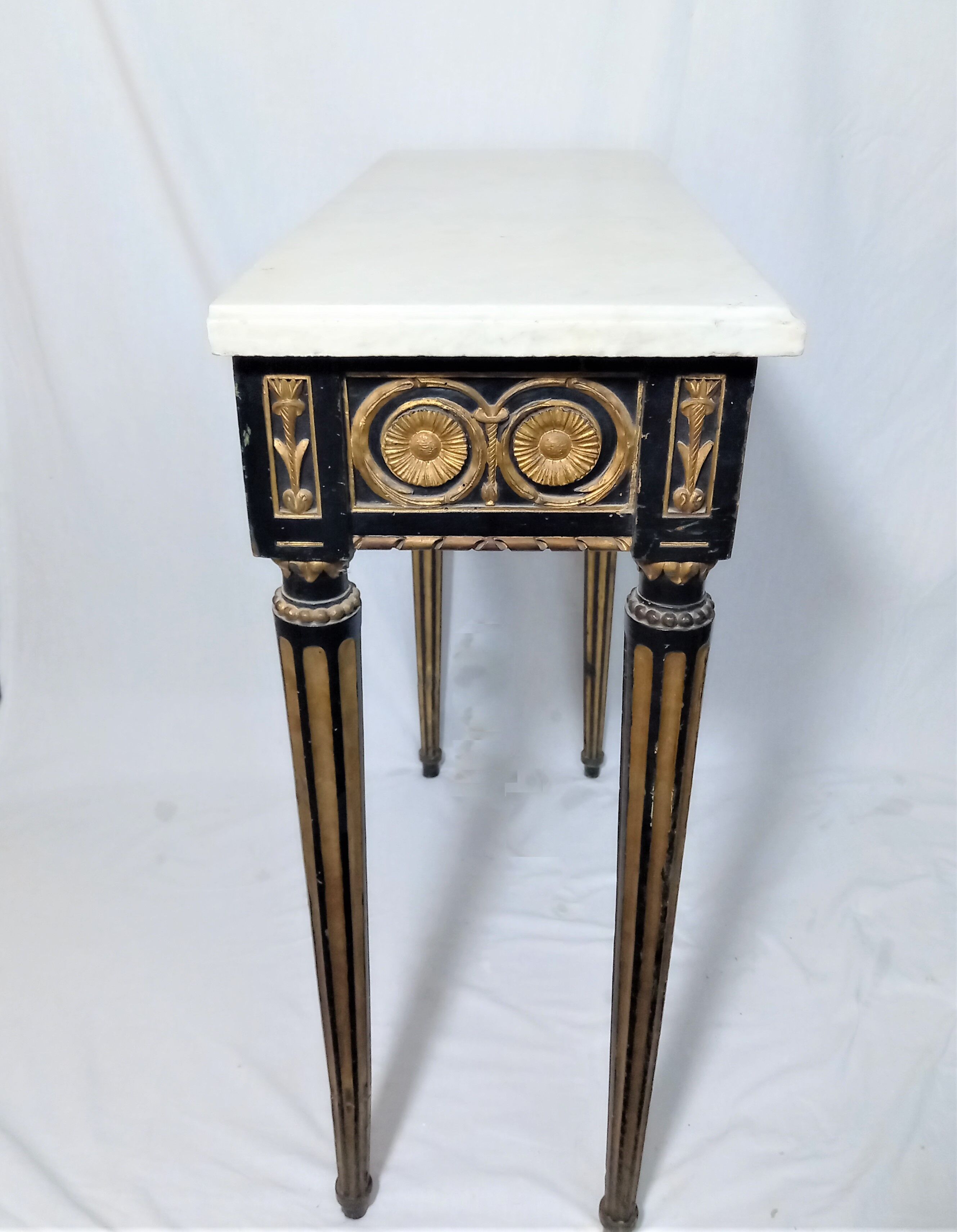 19th century Louis XVI style console table in black and gold with white marble shelf