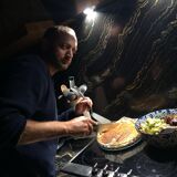 Elda armchair by Joe Colombo, black shell, brown leather