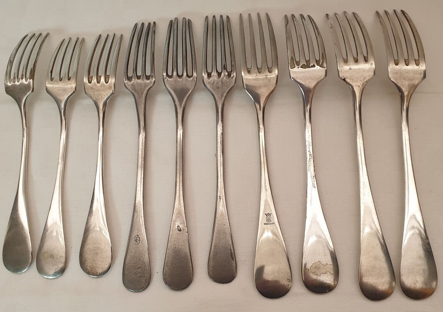 10 mismatched silver metal forks