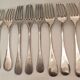 10 mismatched silver metal forks