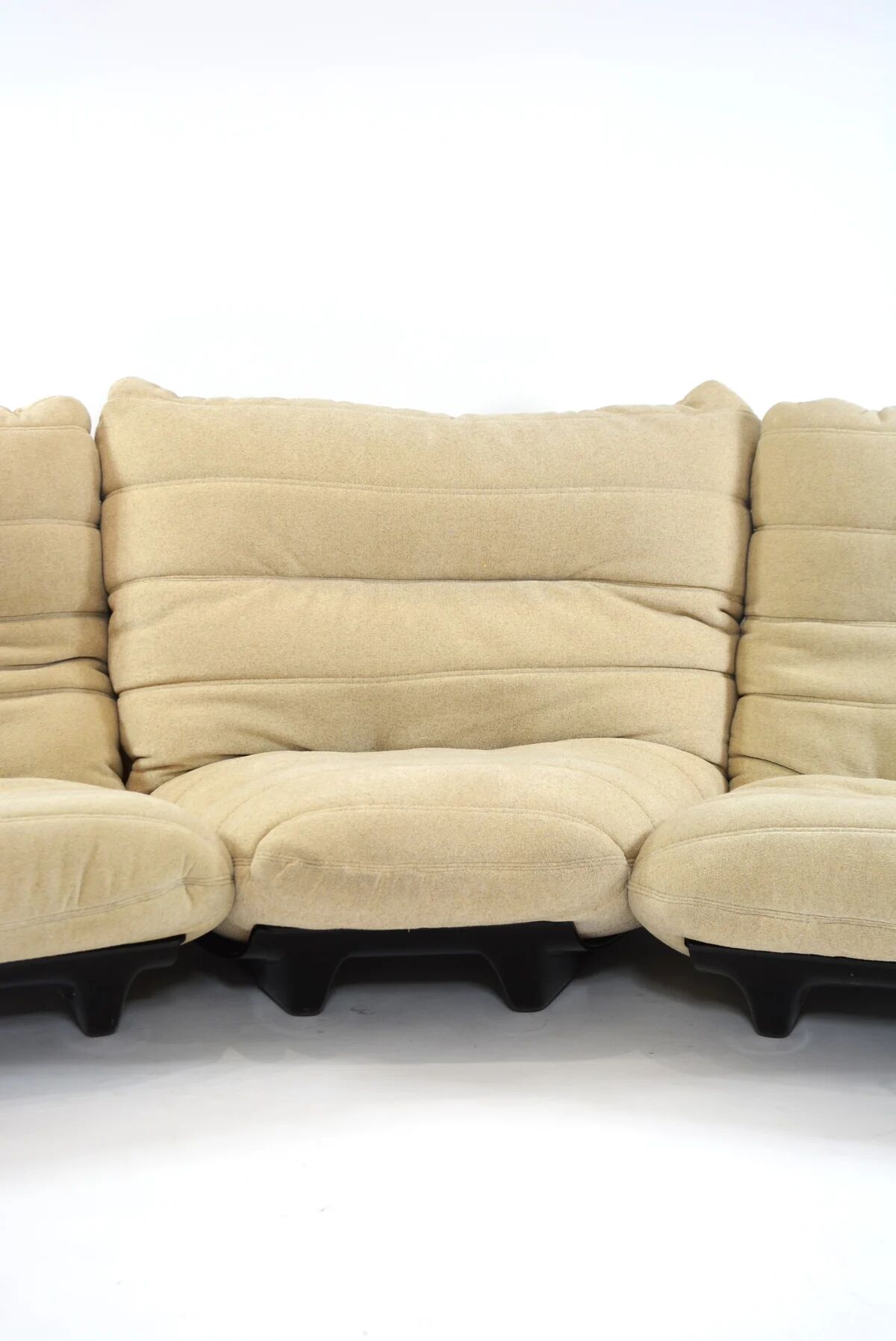 Marsala armchair and its light beige Ligne Roset footrest.