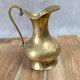 Small antique engraved brass jug