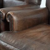 Set of two characterful sheepskin armchairs with a beautiful deep colour