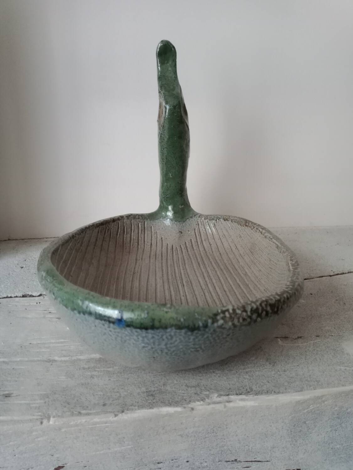 Empty pocket cup forming a bird