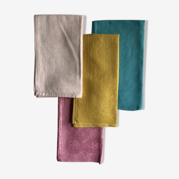 Set of four old damask towels tinted in multiple colors