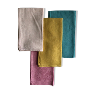 Set of four old damask towels tinted in multiple colors