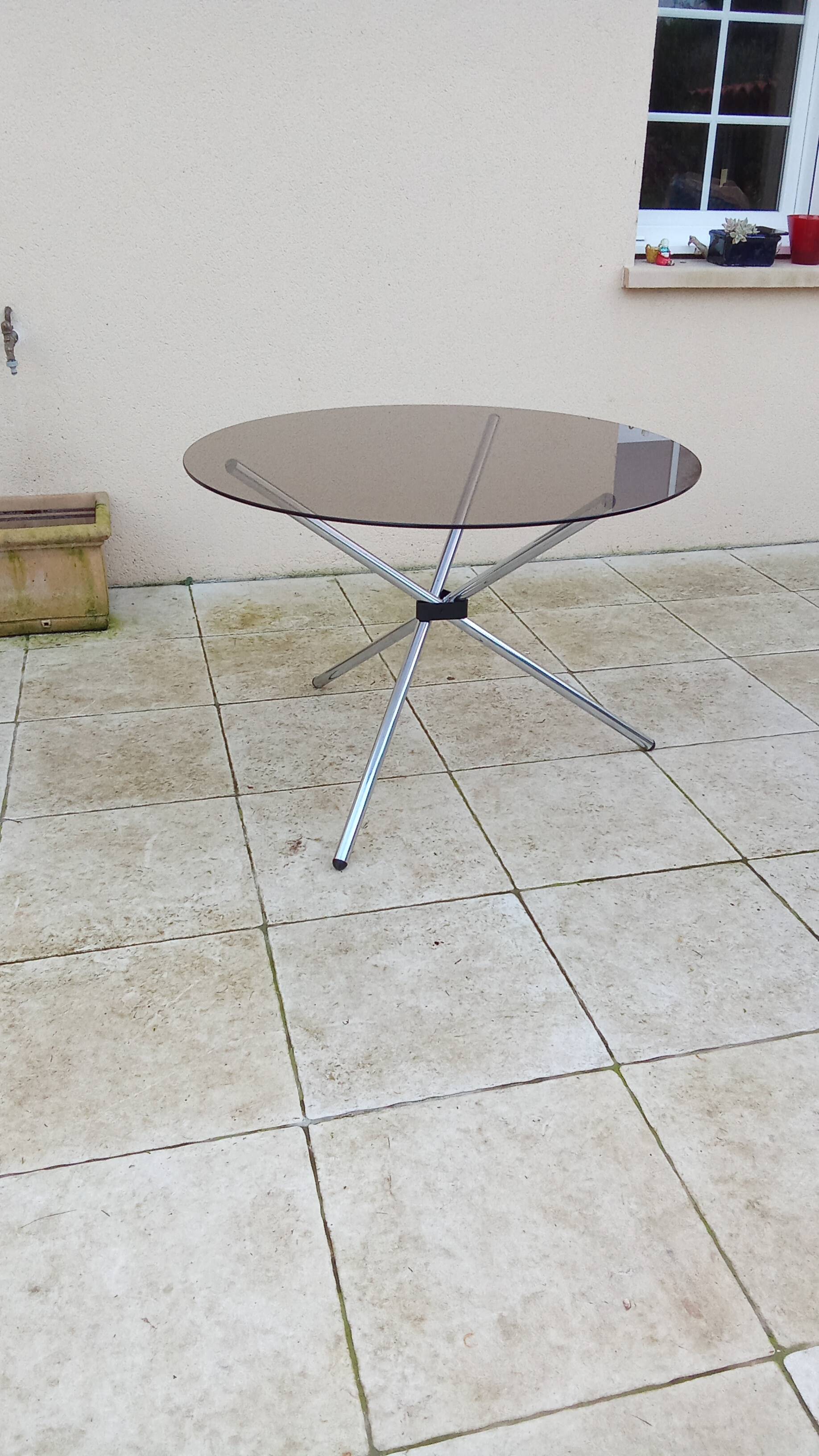 Vintage 70s table with glass and chrome legs.