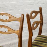 Set of four oak and wool dining room chairs by Henning Kjaernulf, 1960's