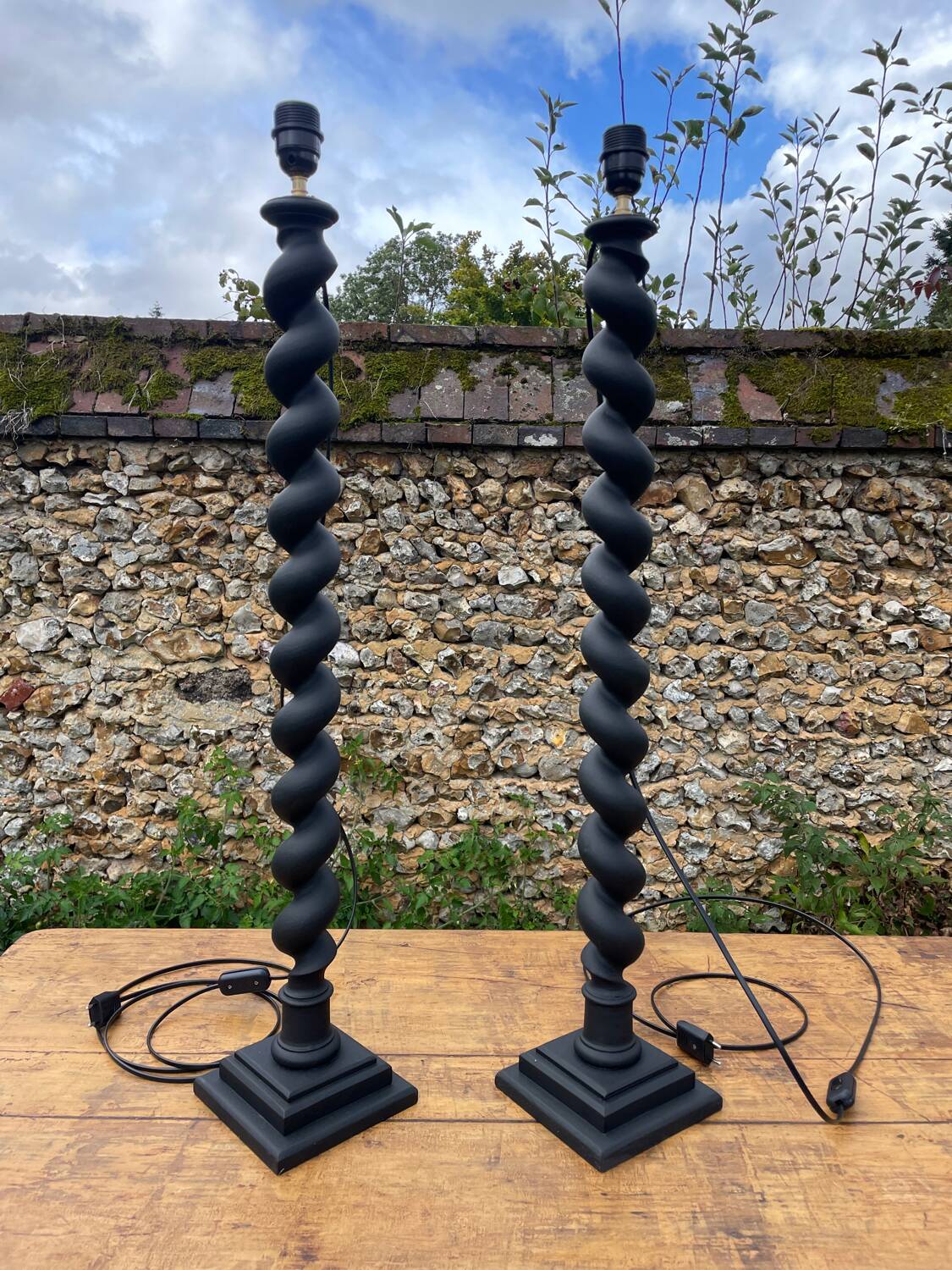 Pair of antique black twisted lamps
