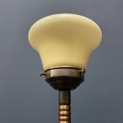 Standing copper table lamp with glass shade