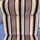 Vintage 1970s lounge chair – striped orange, brown, and cream velvet