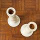 Pair of white wooden candlesticks