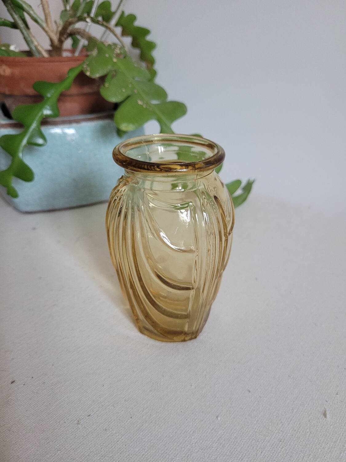 Small yellow draped bulb vase