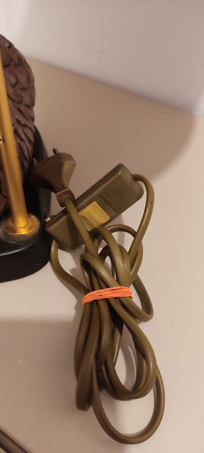 Decorative table lamp with a sculpted duck-shaped base and painted finish.