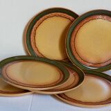 Six vintage stoneware plates with green net
