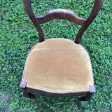 Old wooden chair with upholstered seat