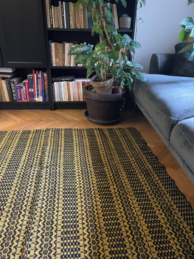 Romanian vintage carpet black design on a yellow background