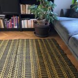 Romanian vintage carpet black design on a yellow background