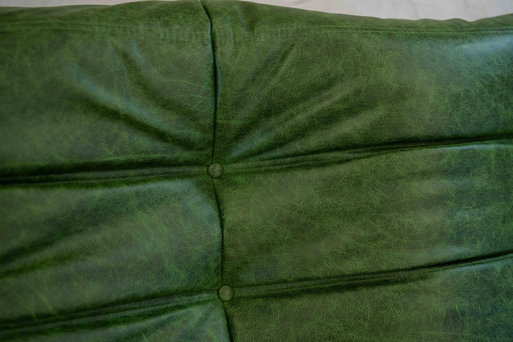 Togo chaise lounge in green leather attributed to Michel Ducaroy for Ligne Roset, 1974