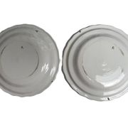 Moustiers, pairs of plates with wading bird design, scalloped edge, early 20th century.