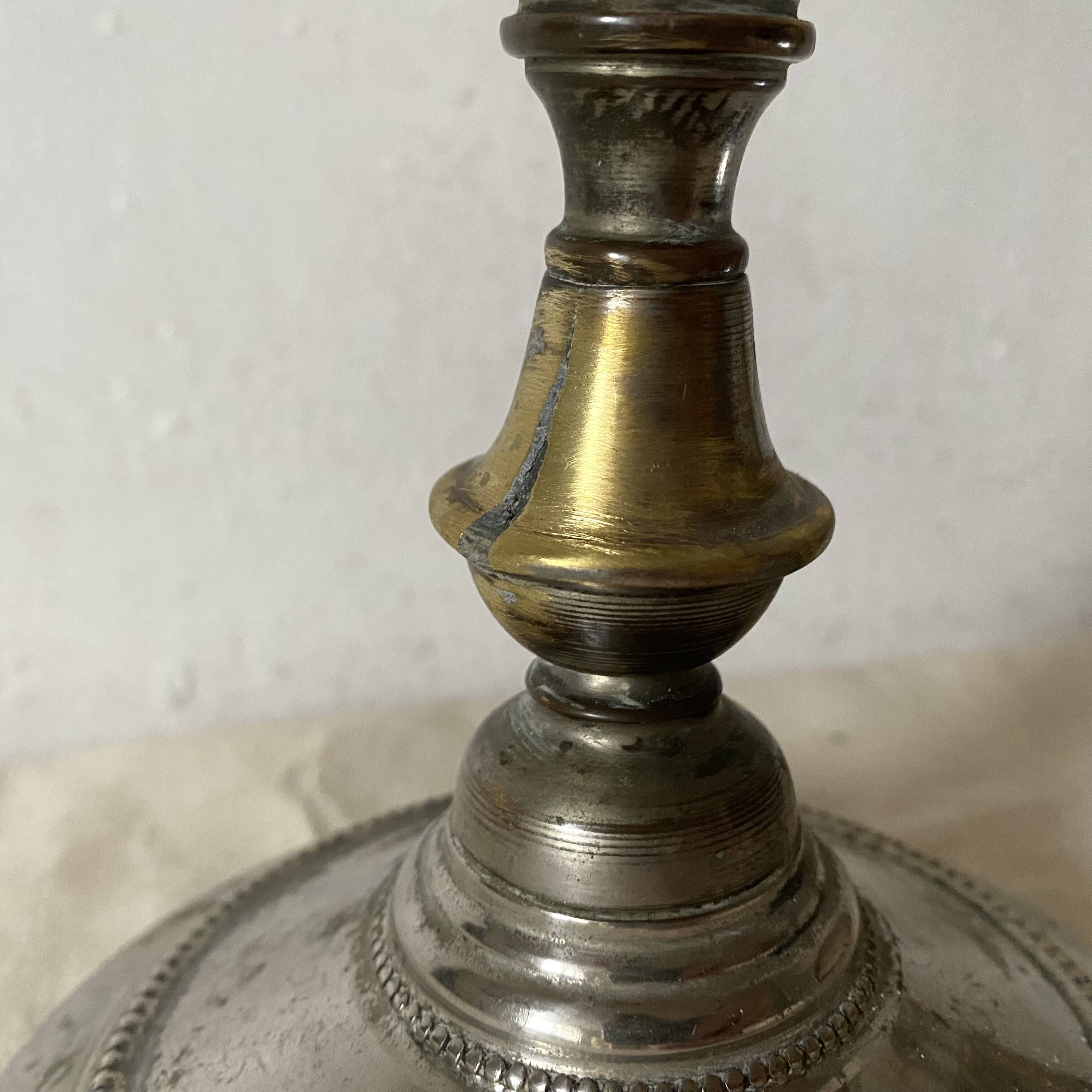 Antique jeweller's lamp, silver-plated base, frosted pink glass shade.