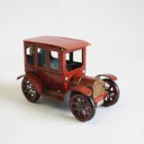 Vintage tin car with pull lever