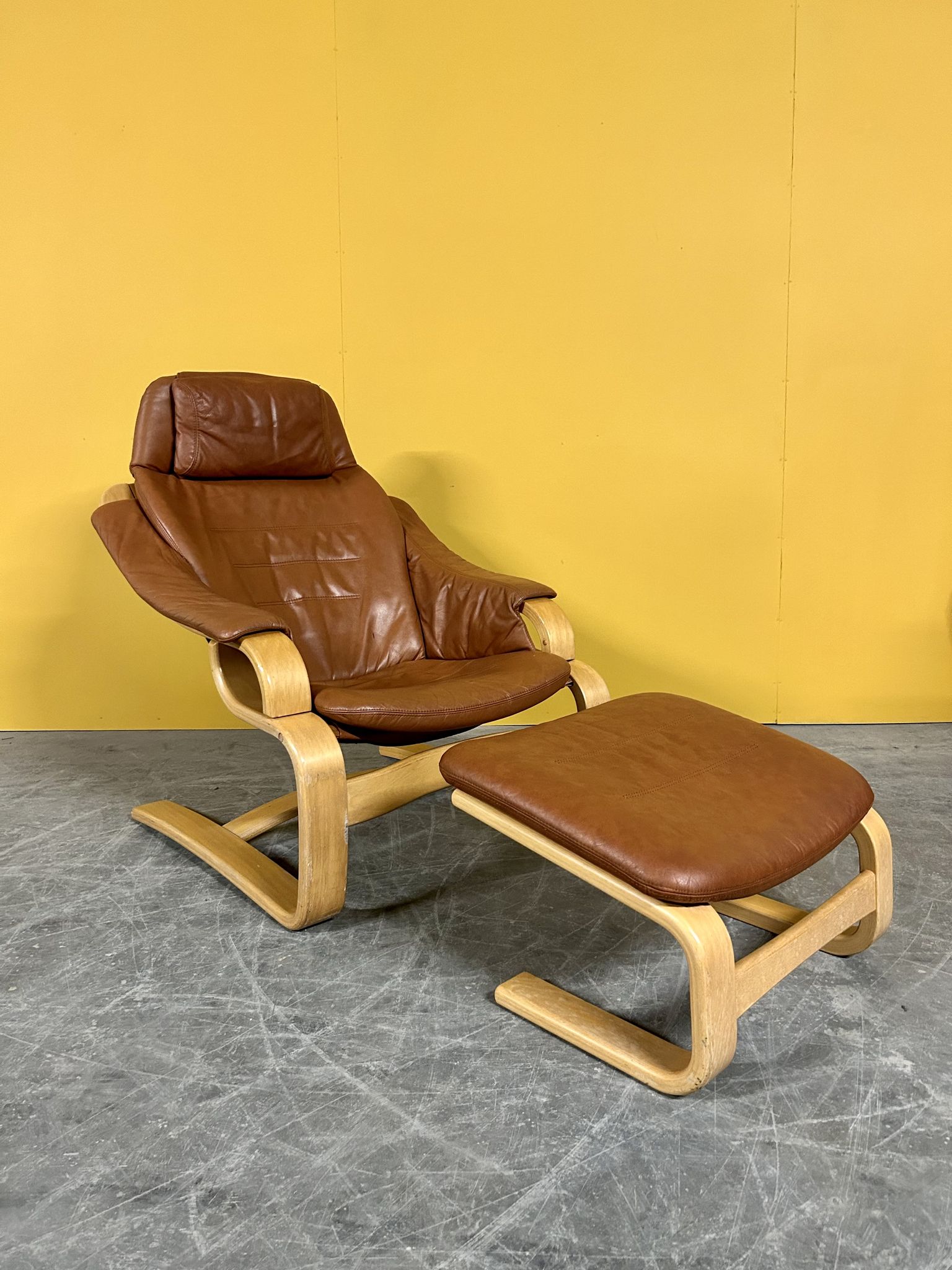 Danish vintage cognac leather armchair and footstool by Skipper Mobler