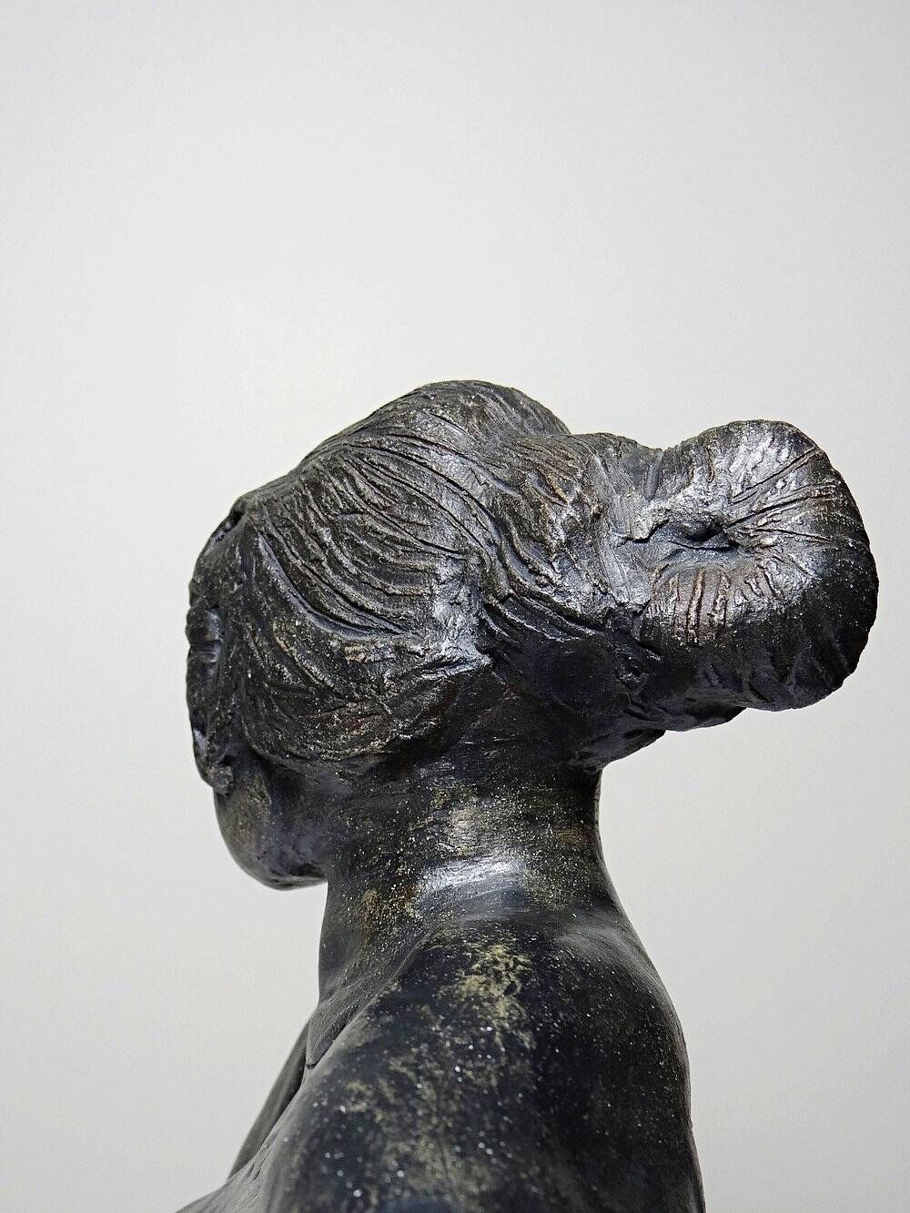 20th-century ceramic bust of a woman, an unidentified piece of art.
