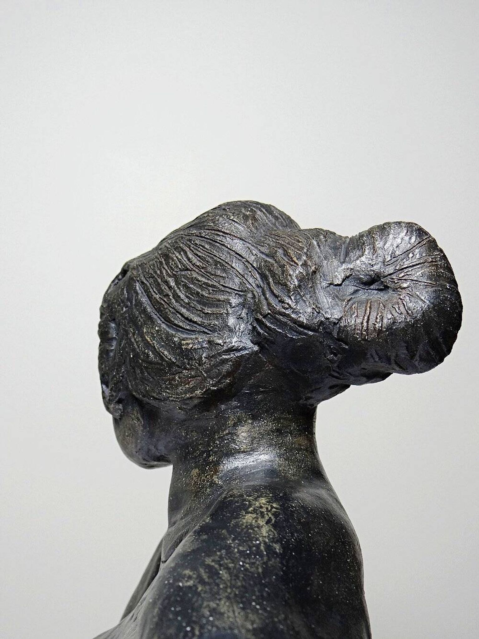 20th-century ceramic bust of a woman, an unidentified piece of art.