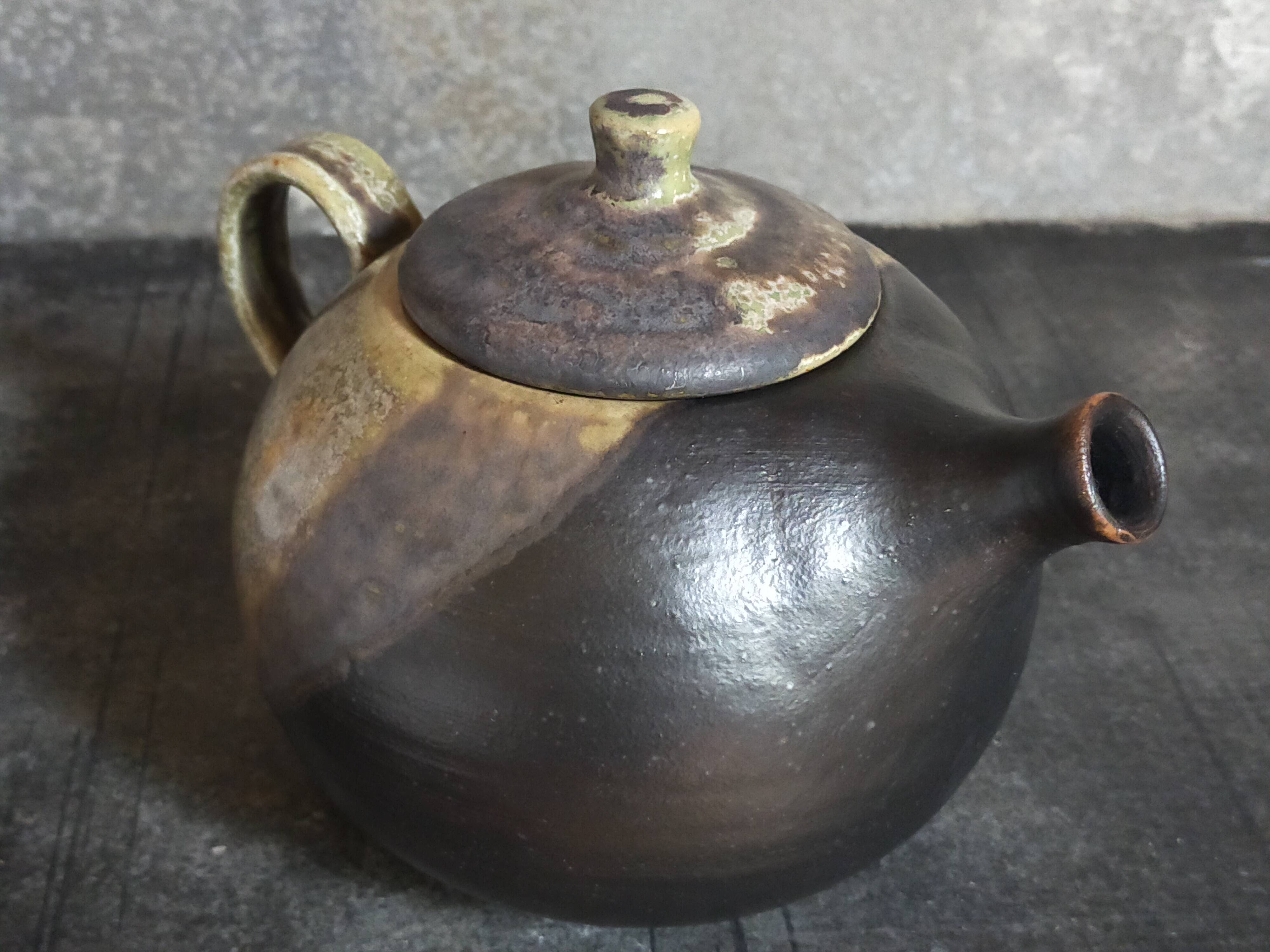 Vintage enameled stoneware potter's teapot