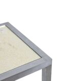 Maison Jansen. Console in brushed aluminium and verre églomisé top.