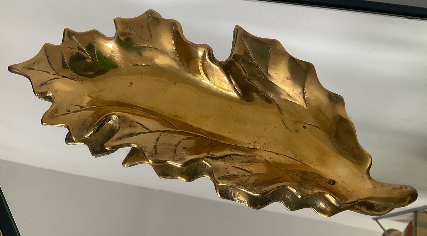 Vintage solid bronze leaf pocket emptier