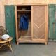Vintage sliding wardrobe in raw oak