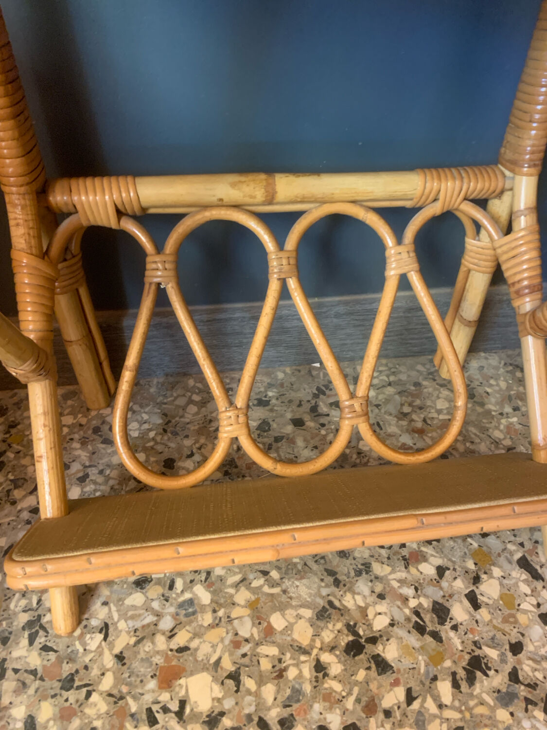 A pair of rattan bedside tables.