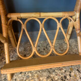 A pair of rattan bedside tables.