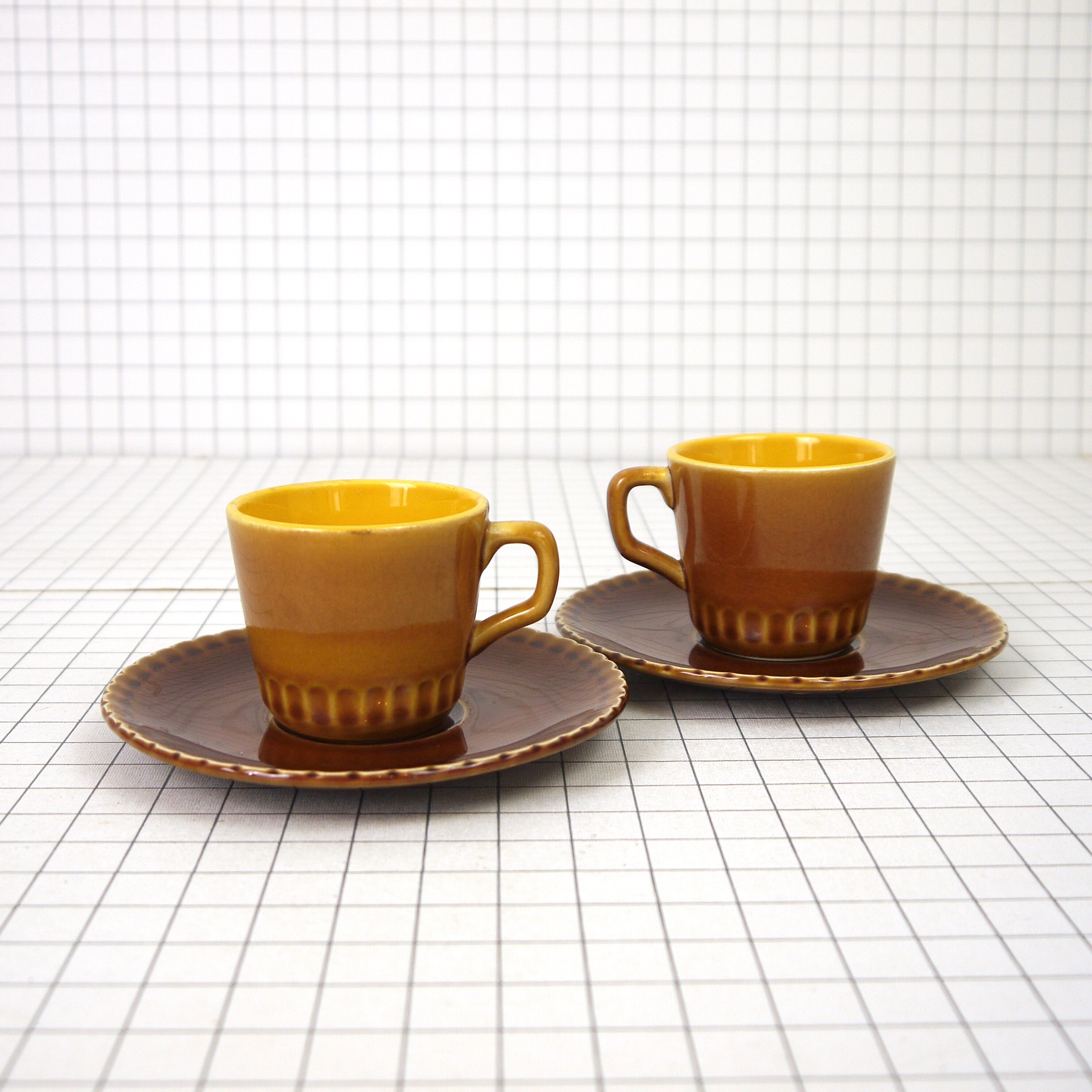 Two Digoin cups and saucers