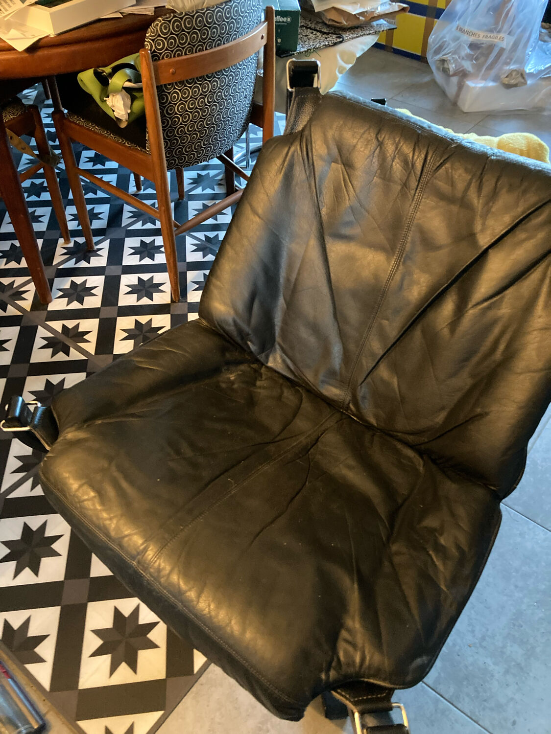 Leather Falcon armchair and footrest