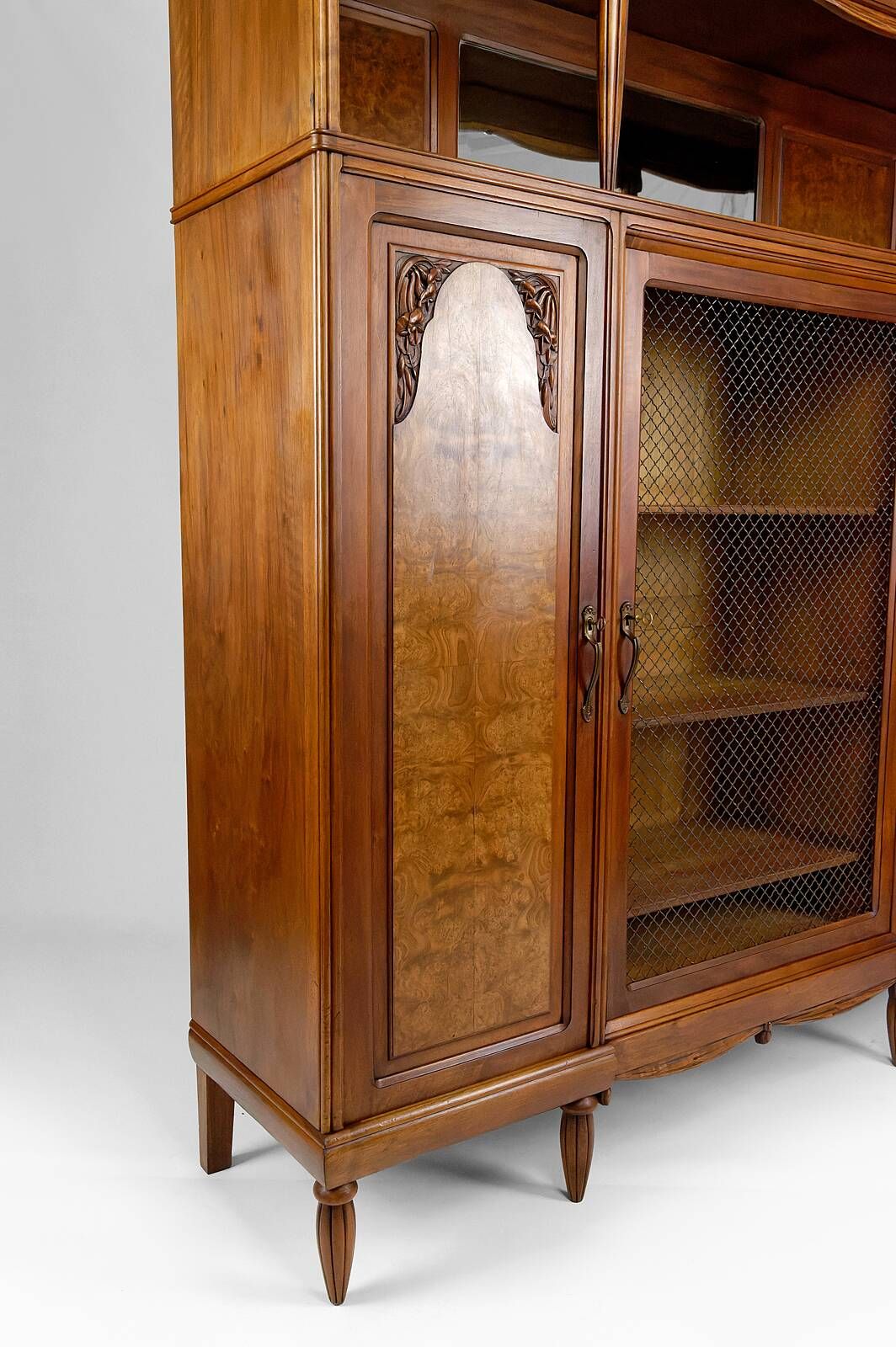 Art Deco showcase bookcase in carved walnut, France, circa 1925