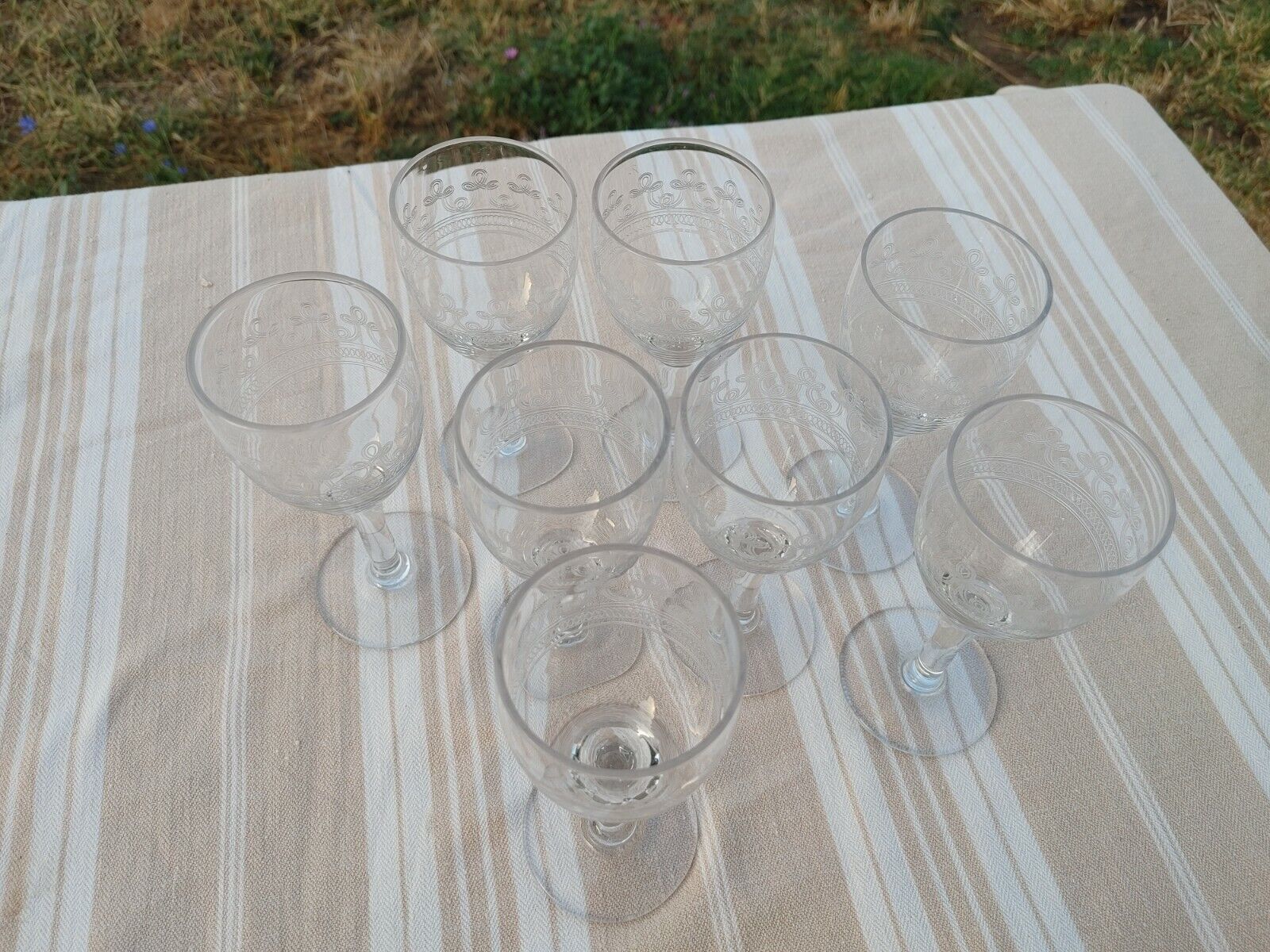 8 old white wine glasses engraved with a frieze late 19th early 20th
