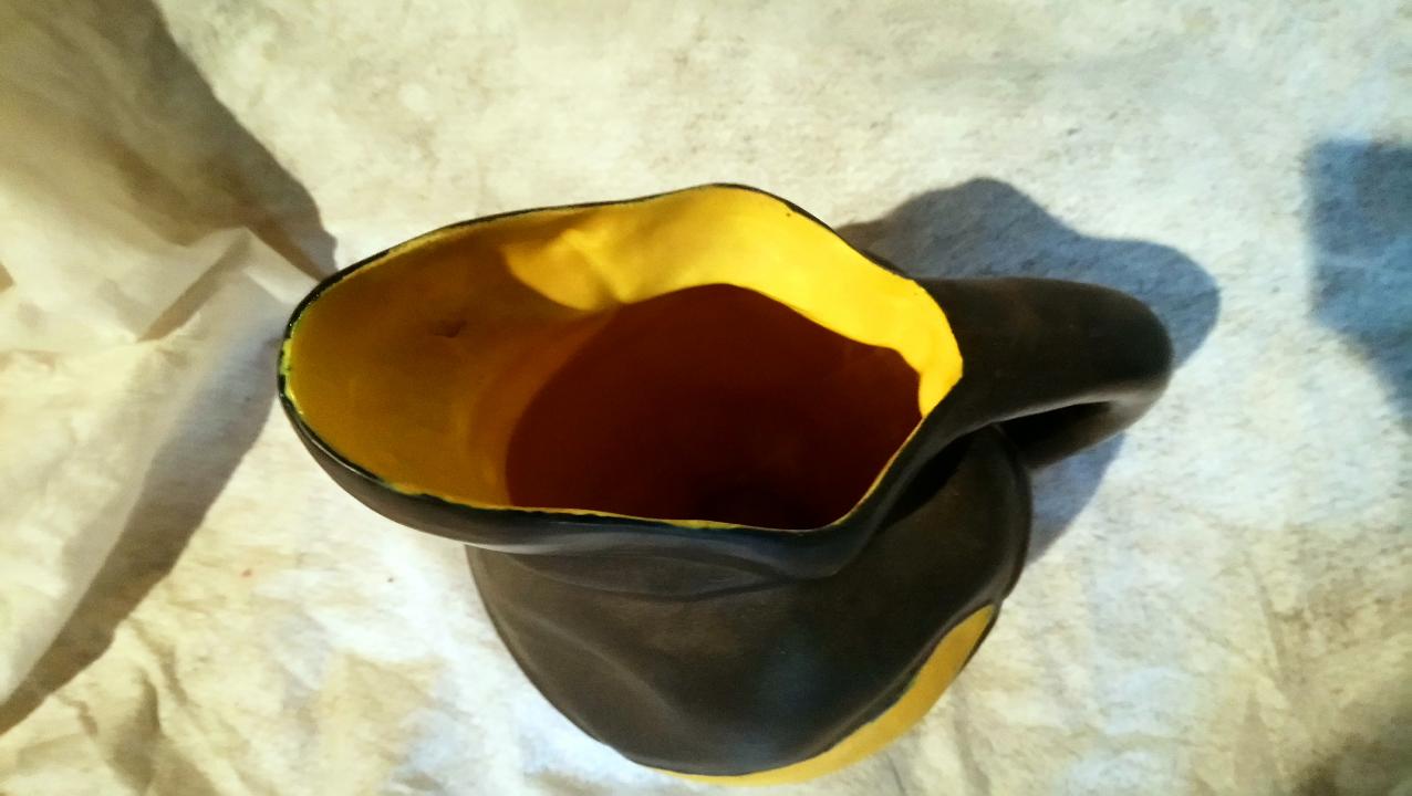 Yellow and Black ceramic pitcher