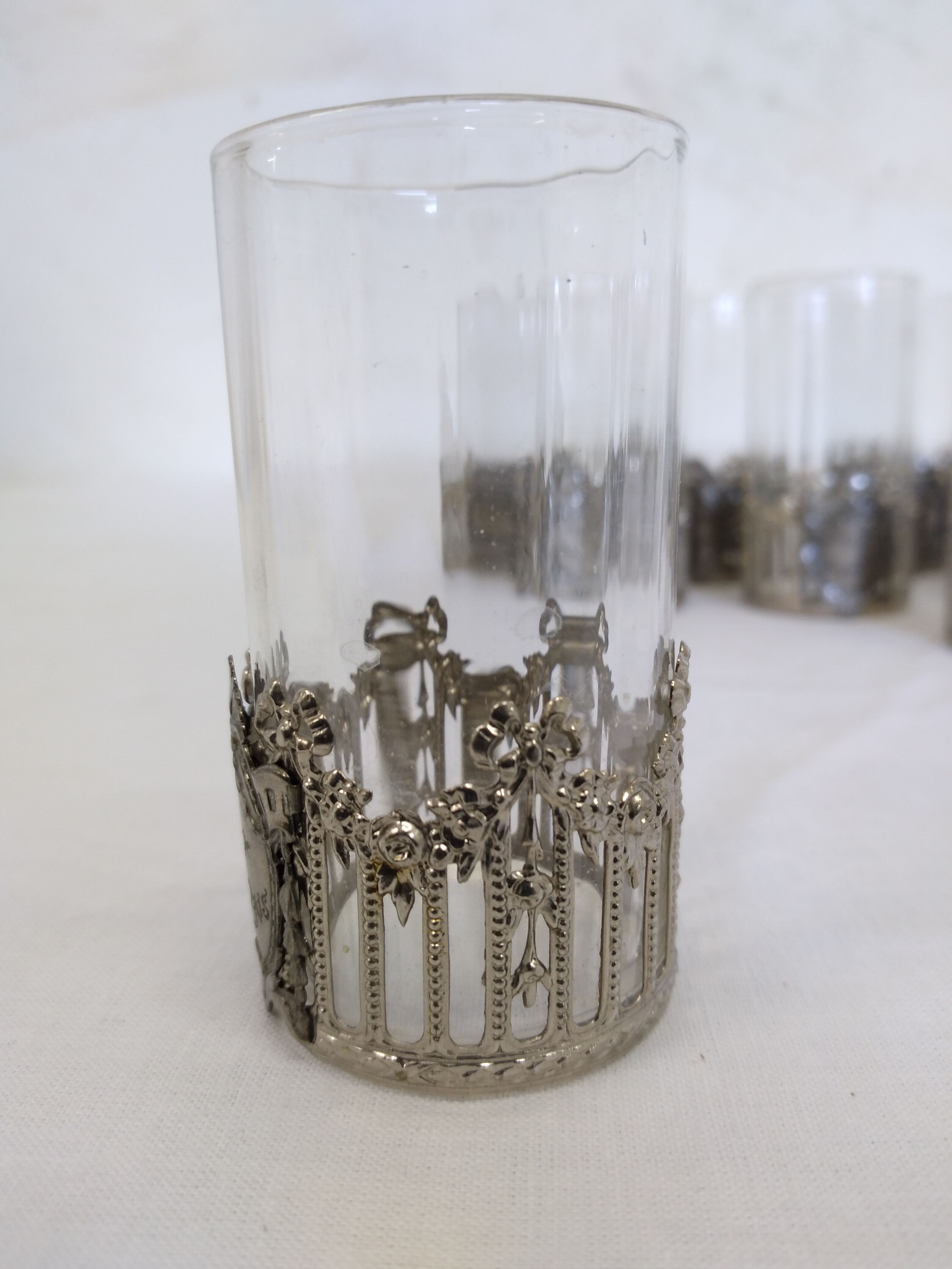 Glass with art deco strapping